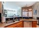 A kitchen with granite countertops, stainless steel appliances, and an open layout at 16441 S Mountain Stone Trl, Phoenix, AZ 85048
