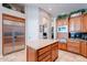 A kitchen with a large island, stainless steel appliances, and custom cabinets at 16441 S Mountain Stone Trl, Phoenix, AZ 85048