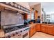 A kitchen with stainless steel appliances, granite countertops, and custom cabinets at 16441 S Mountain Stone Trl, Phoenix, AZ 85048