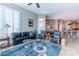 Inviting living room with neutral walls, tile flooring, and views into the breakfast nook at 16441 S Mountain Stone Trl, Phoenix, AZ 85048