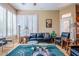 Bright living room features elegant furnishings, natural light from large windows, and stylish decor for comfortable living at 16441 S Mountain Stone Trl, Phoenix, AZ 85048