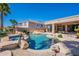 Sparkling pool and spa area with waterfall features and desert landscape, a perfect oasis at 16441 S Mountain Stone Trl, Phoenix, AZ 85048