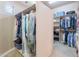 Expansive walk-in closet with shelving and racks, offering generous storage solutions at 16441 S Mountain Stone Trl, Phoenix, AZ 85048