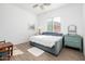 Bright bedroom featuring a daybed, natural light, and charming decor at 17054 W Saguaro Park Ln, Surprise, AZ 85387