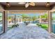 Inviting outdoor patio with dining and seating areas, and views of the swimming pool at 17054 W Saguaro Park Ln, Surprise, AZ 85387