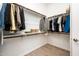 Walk-in closet featuring ample shelving and hanging space for organized storage at 17054 W Saguaro Park Ln, Surprise, AZ 85387