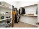 Walk-in closet with shelving and hanging rods for optimal storage at 17054 W Saguaro Park Ln, Surprise, AZ 85387