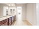 Elegant bathroom with granite countertop, double vanity and tile floors at 18840 N 269Th Ave, Buckeye, AZ 85396