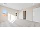 Spacious bedroom with plush carpeting and natural light at 18840 N 269Th Ave, Buckeye, AZ 85396