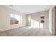 Large bedroom features plush carpeting and oversized windows at 18840 N 269Th Ave, Buckeye, AZ 85396