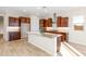Well-appointed kitchen with wooden cabinets, granite countertops, a center island, and stainless steel appliances at 18840 N 269Th Ave, Buckeye, AZ 85396