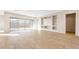 Spacious living room with tile flooring, sliding glass doors, and a built-in entertainment center at 18840 N 269Th Ave, Buckeye, AZ 85396
