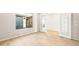 Bright living room with tile flooring, a large window, and glass French doors at 18840 N 269Th Ave, Buckeye, AZ 85396
