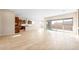 Open-concept layout with a living area and kitchen, featuring tile floors and sliding glass doors to the patio at 18840 N 269Th Ave, Buckeye, AZ 85396
