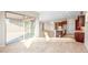 Spacious living area opens to the kitchen with a view to outdoor living area at 18840 N 269Th Ave, Buckeye, AZ 85396