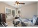 Bright bedroom with natural light with shuttered windows and neutral color palette at 20501 N 93Rd Ave, Peoria, AZ 85382