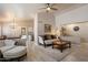 Comfortable living room with vaulted ceiling, plush seating and modern decor at 20501 N 93Rd Ave, Peoria, AZ 85382