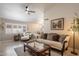 Open living space with plenty of natural light, stylish furniture and wood-look flooring at 20501 N 93Rd Ave, Peoria, AZ 85382