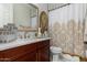 Bathroom featuring a single sink vanity, modern faucet, and tub with shower at 20839 E Kingbird Dr, Queen Creek, AZ 85142