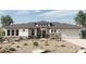 Charming single-story home with stone accents, desert landscaping, and a two-car garage at 20847 W Montebello Ave, Buckeye, AZ 85396