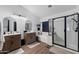 Modern bathroom featuring dual vanities, a soaking tub, and a separate glass-enclosed shower at 21147 E Via Del Oro --, Queen Creek, AZ 85142