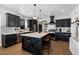 Modern kitchen featuring a large center island, stainless steel appliances, and stylish black and white design at 21147 E Via Del Oro --, Queen Creek, AZ 85142