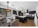 Modern kitchen featuring a large center island, stainless steel appliances, and stylish dining area at 21147 E Via Del Oro --, Queen Creek, AZ 85142