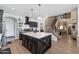 Modern kitchen with a large island, stainless steel appliances, and an open layout flowing to living area at 21147 E Via Del Oro --, Queen Creek, AZ 85142