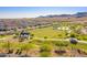 Aerial view of a vibrant community featuring green spaces, playgrounds, and well-maintained landscaping at 21412 W Hubbell St, Buckeye, AZ 85396
