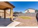 Landscaped backyard with a gazebo, seating area, rock ground cover, and partial mountain views at 21412 W Hubbell St, Buckeye, AZ 85396