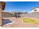 Spacious backyard featuring a gazebo, landscaping, rock ground cover and partial mountain views at 21412 W Hubbell St, Buckeye, AZ 85396