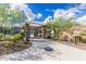 Community pool entrance through a stone and wrought iron pergola offers scenic desert views at 21412 W Hubbell St, Buckeye, AZ 85396