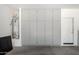 Functional garage space with storage cabinets, water heater, and door access at 21412 W Hubbell St, Buckeye, AZ 85396