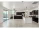 Open kitchen featuring an island, modern appliances, and a seamless transition to the living space at 21412 W Hubbell St, Buckeye, AZ 85396