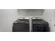 Modern black washer and dryer set in a laundry room offering convenience and style at 21412 W Hubbell St, Buckeye, AZ 85396