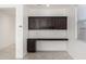 Stylish office space with dark wood cabinets and a built-in desk area at 21412 W Hubbell St, Buckeye, AZ 85396