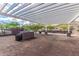 Community outdoor grilling area with pergola shade and picnic tables at 21412 W Hubbell St, Buckeye, AZ 85396