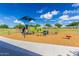 Community playground area featuring slides, climbing structures and a soft landing surface, perfect for  at 21412 W Hubbell St, Buckeye, AZ 85396