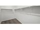 Walk-in closet offering ample storage with shelving and carpeting at 21412 W Hubbell St, Buckeye, AZ 85396