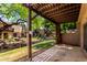 Relax on this outdoor patio with views of the community waterway and lush green landscaping at 2232 W Lindner Ave # 20, Mesa, AZ 85202