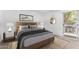 Bedroom with large windows, bed, nightstand, and mirror at 2232 W Lindner Ave # 20, Mesa, AZ 85202