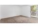 Bedroom view, features include carpet floors and a glass door to the exterior at 2232 W Lindner Ave # 20, Mesa, AZ 85202