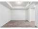 Clean, vacant bedroom showcasing laminate floors, white walls, and a spacious closet at 2232 W Lindner Ave # 20, Mesa, AZ 85202