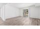 Bright and airy living room with sliding glass doors and sleek, modern flooring at 2232 W Lindner Ave # 20, Mesa, AZ 85202