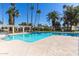 Enjoy the sparkling community pool surrounded by beautiful landscaping and mature palm trees at 2232 W Lindner Ave # 20, Mesa, AZ 85202