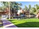Beautiful community with well-maintained landscaping, serene water feature, bridge and lush trees at 2232 W Lindner Ave # 20, Mesa, AZ 85202