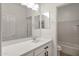 Bright bathroom features a single sink, modern fixtures, and tile flooring in the shower and toilet area at 22472 E Sonoqui Blvd, Queen Creek, AZ 85142
