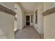 View of the home's arched front entryway with a secure screen door and neutral color palette at 22472 E Sonoqui Blvd, Queen Creek, AZ 85142