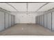 Spacious garage featuring abundant storage cabinets along the perimeter at 22472 E Sonoqui Blvd, Queen Creek, AZ 85142
