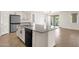 Bright kitchen with granite countertops, a large island, and stainless-steel appliances at 22472 E Sonoqui Blvd, Queen Creek, AZ 85142